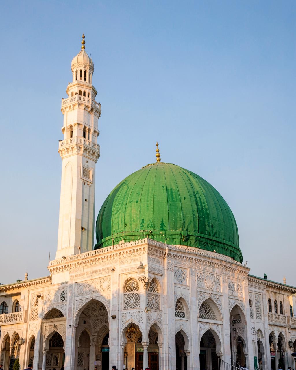 Green dome and white minaret of a mosque